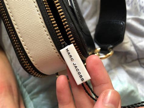 how to spot a fake marc jacobs snapshot bag|marc jacobs snapshot bag price.